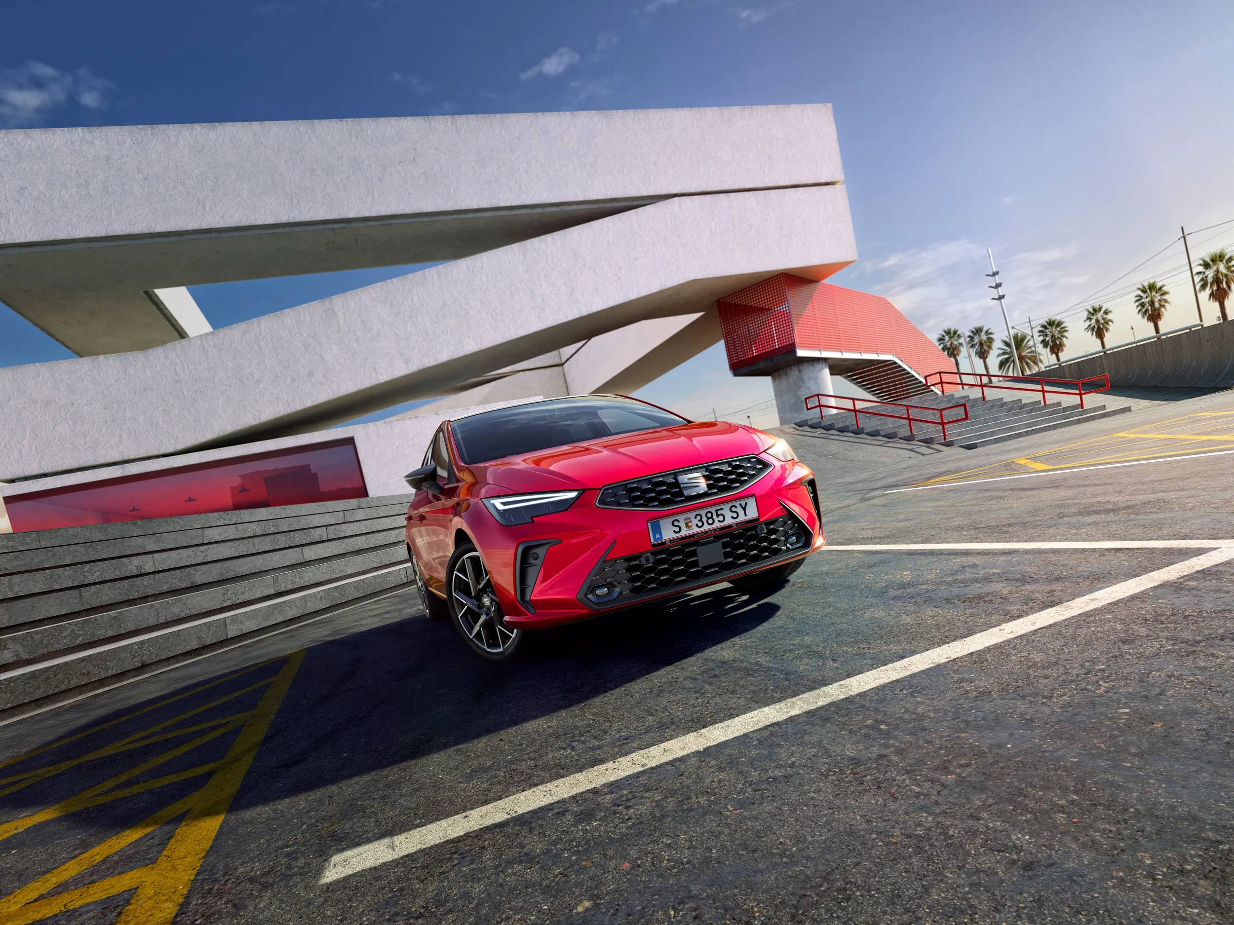 Vista lateral do novo SEAT Ibiza na versão FR, estacionado ao ar livre.