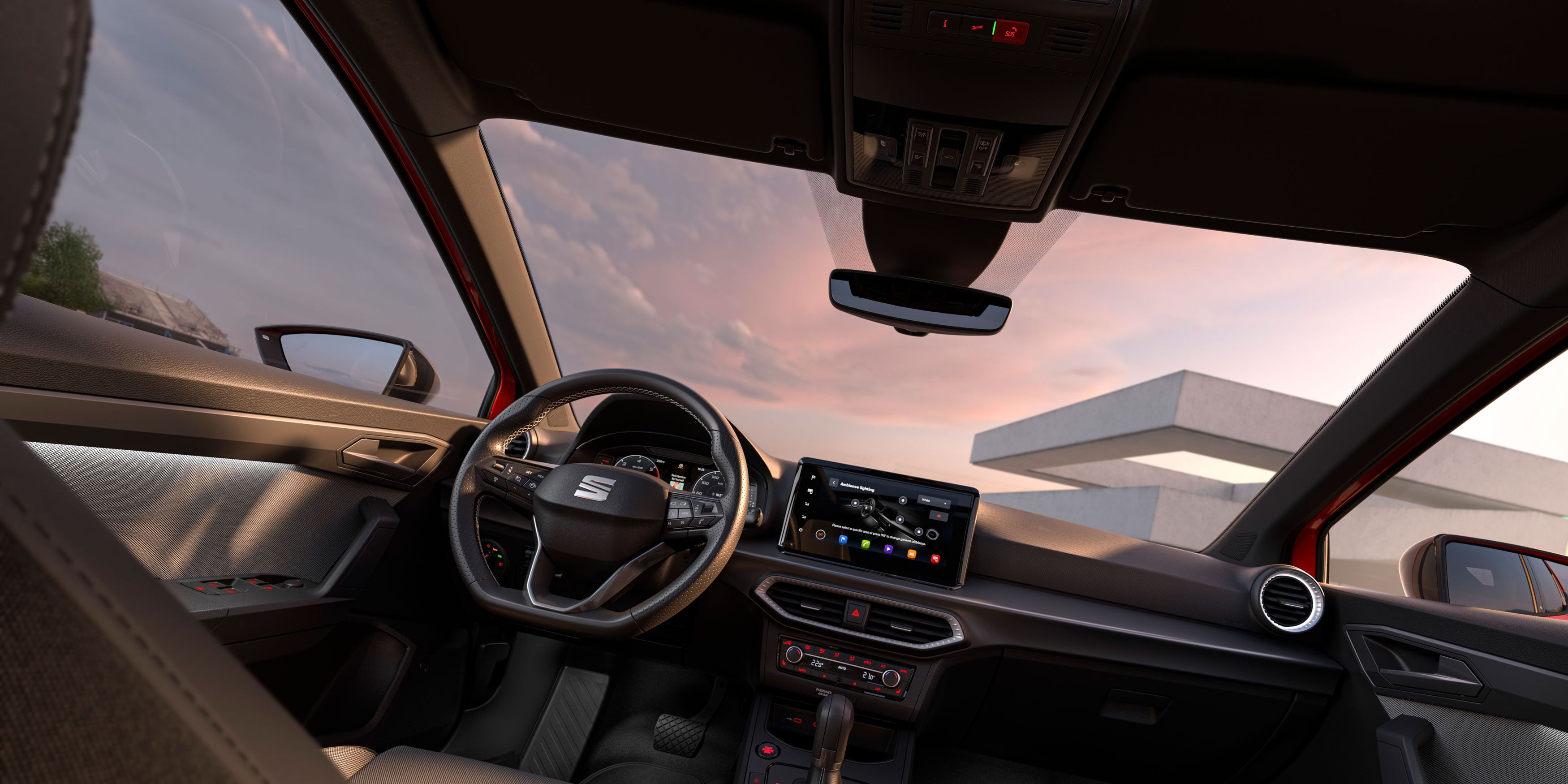 Vista do interior do novo SEAT Ibiza, destacando detalhes como parte dos estofos, o ecrã tátil ou o volante.