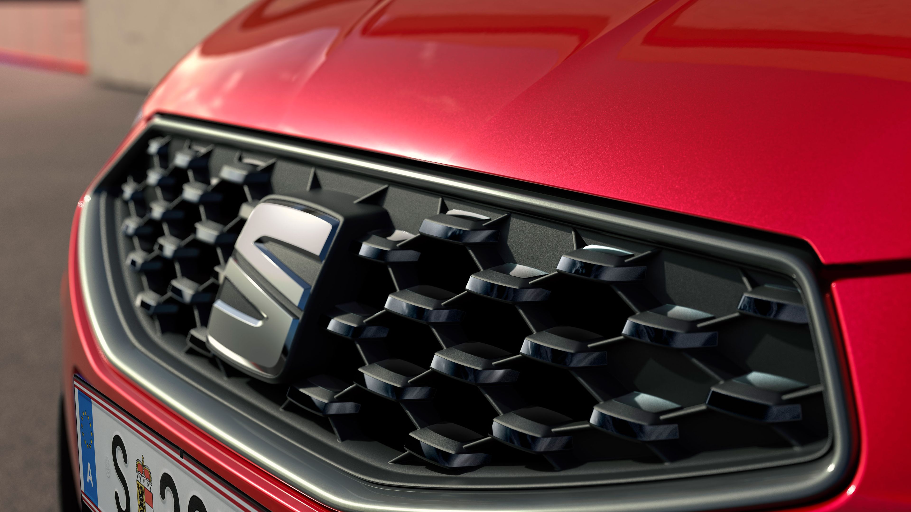 Close-up da grelha frontal do SEAT Ibiza com design geométrico.